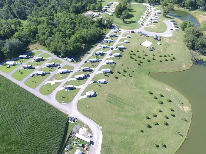 Drone shot of RV pads, mowed lanes, and stocked fishing pond at Buena Vista Farms near Jacksonville Illinois