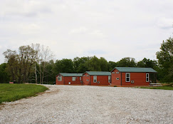 Red tiny home cabins available for nightly rental at Buena Vista Farms in Chapin Illinois