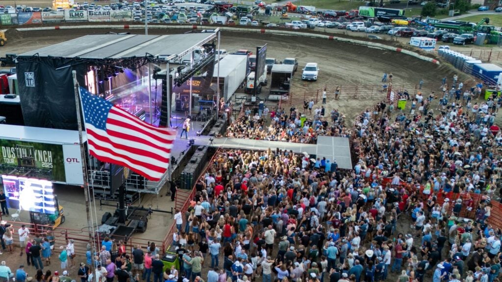 Dustin Lynch concert stage with American flag at the 2025 Morgan County Fair