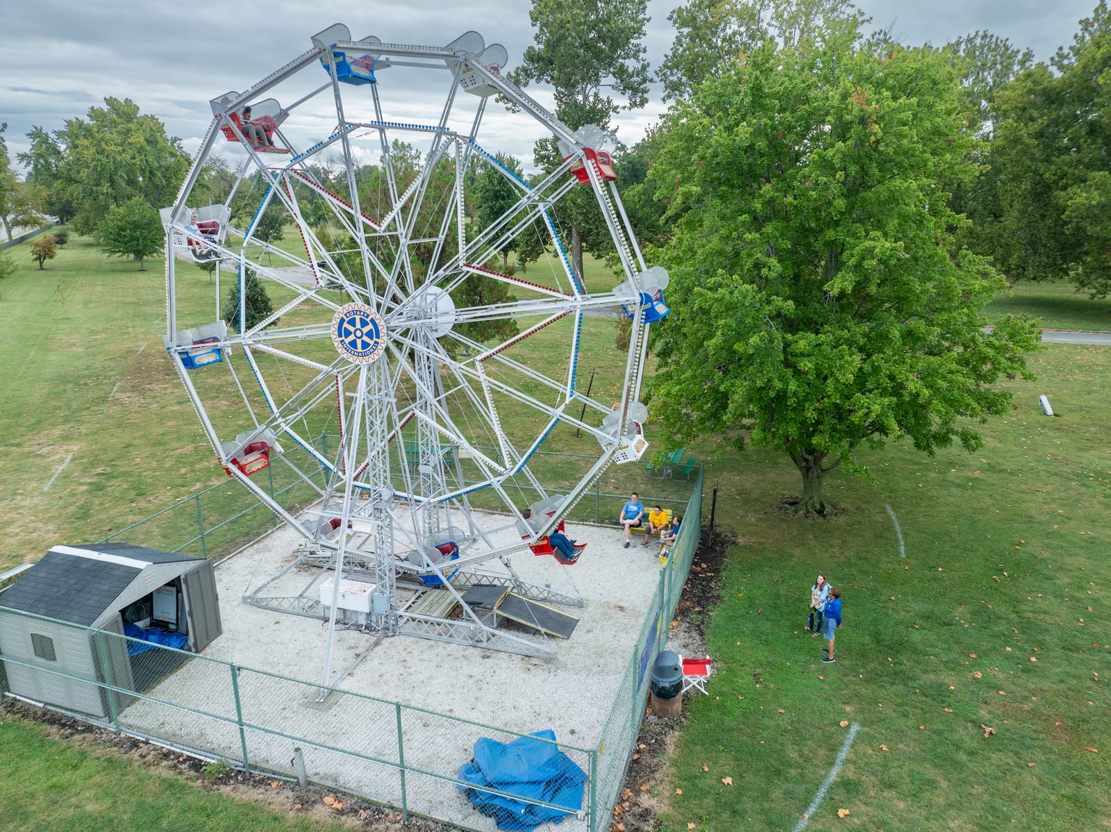 The 1907 Big Eli Ferris Wheel No. 17 operating with riders in Jacksonville Illinois — side aerial drone view