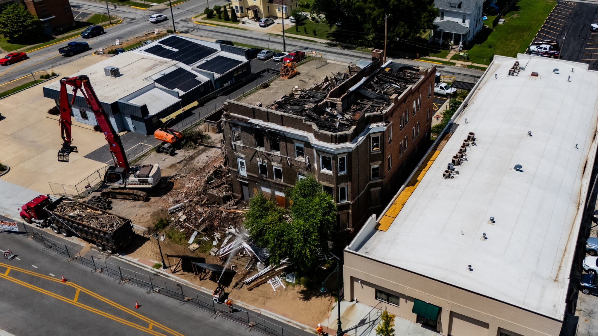 Aerial photo of the charred roofline of the Cherry Apartments building in Jacksonville IL before the east wall came down