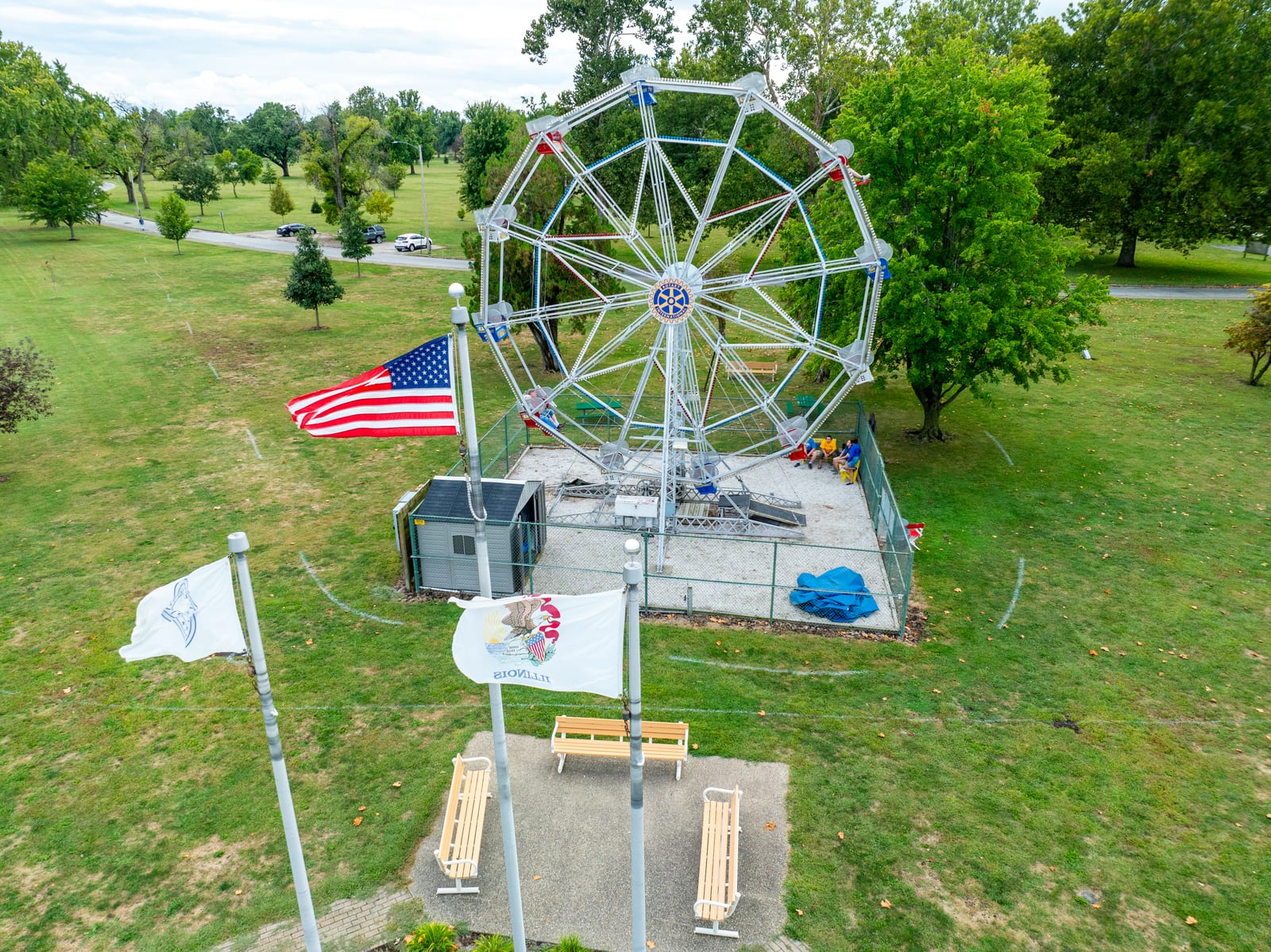 American flag flying in front of the Big Eli Ferris Wheel in Jacksonville IL, captured by drone