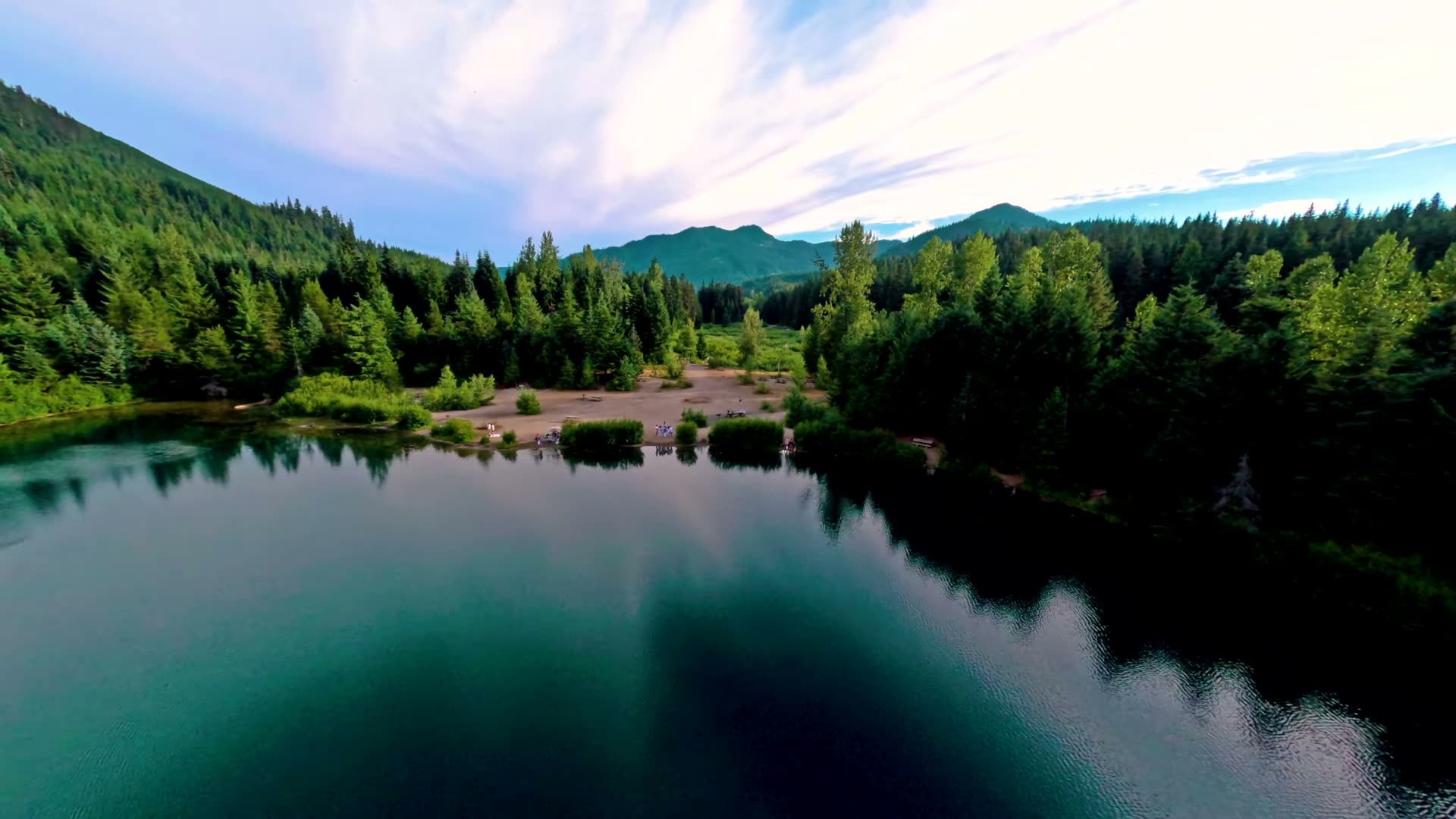 The gravel shoreline and beach area at Gold Creek Pond seen from above