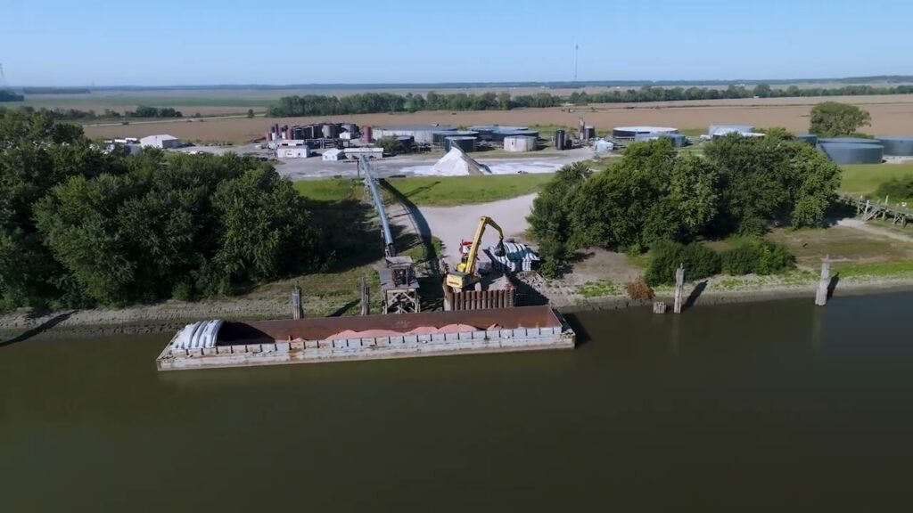 Aerial drone view of asphalt being removed from a barge at the Illinois River terminal in Meredosia, IL