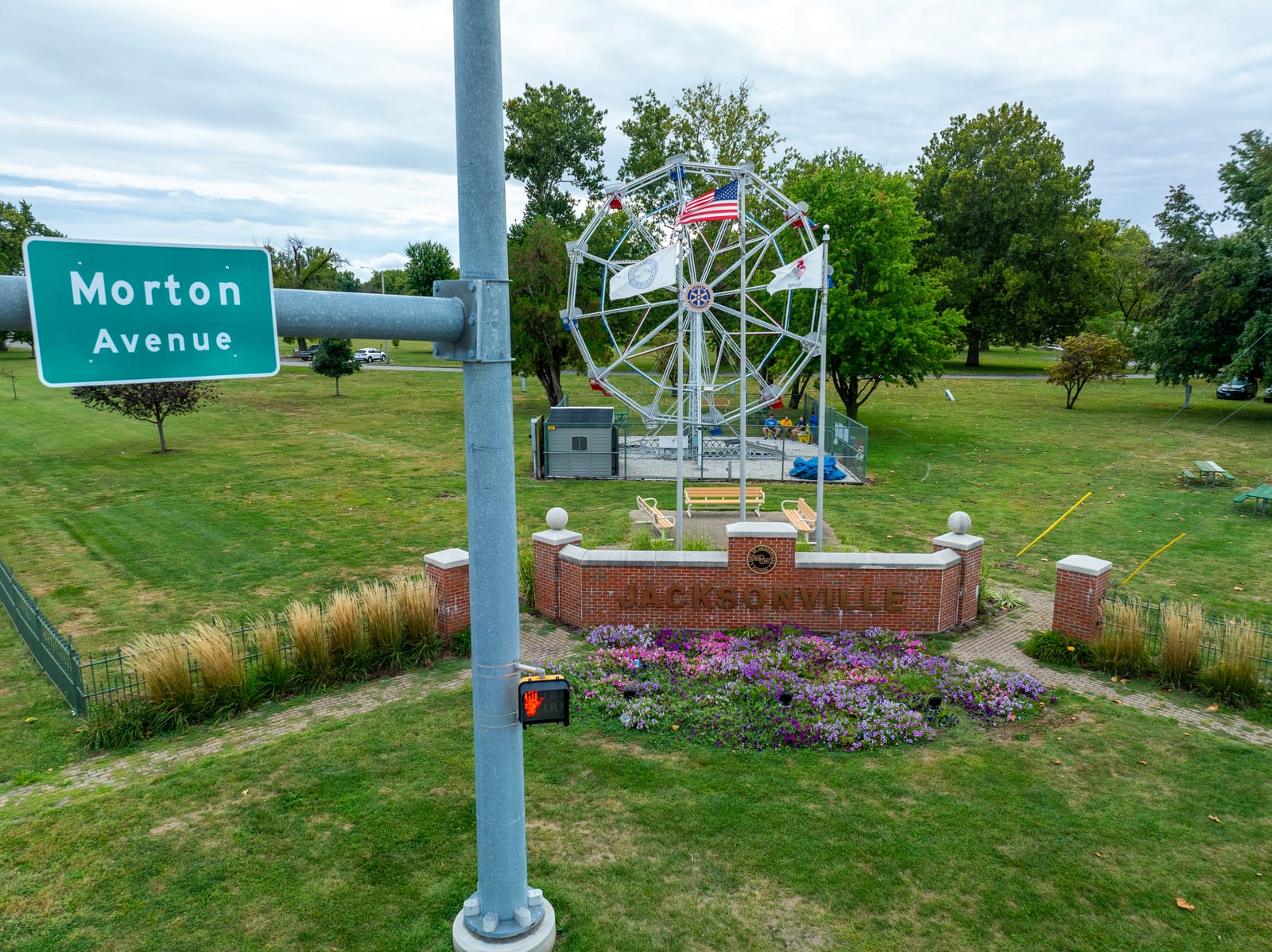 Morton Avenue street sign with the Big Eli Ferris Wheel and Jacksonville brick sign in the background — drone photo