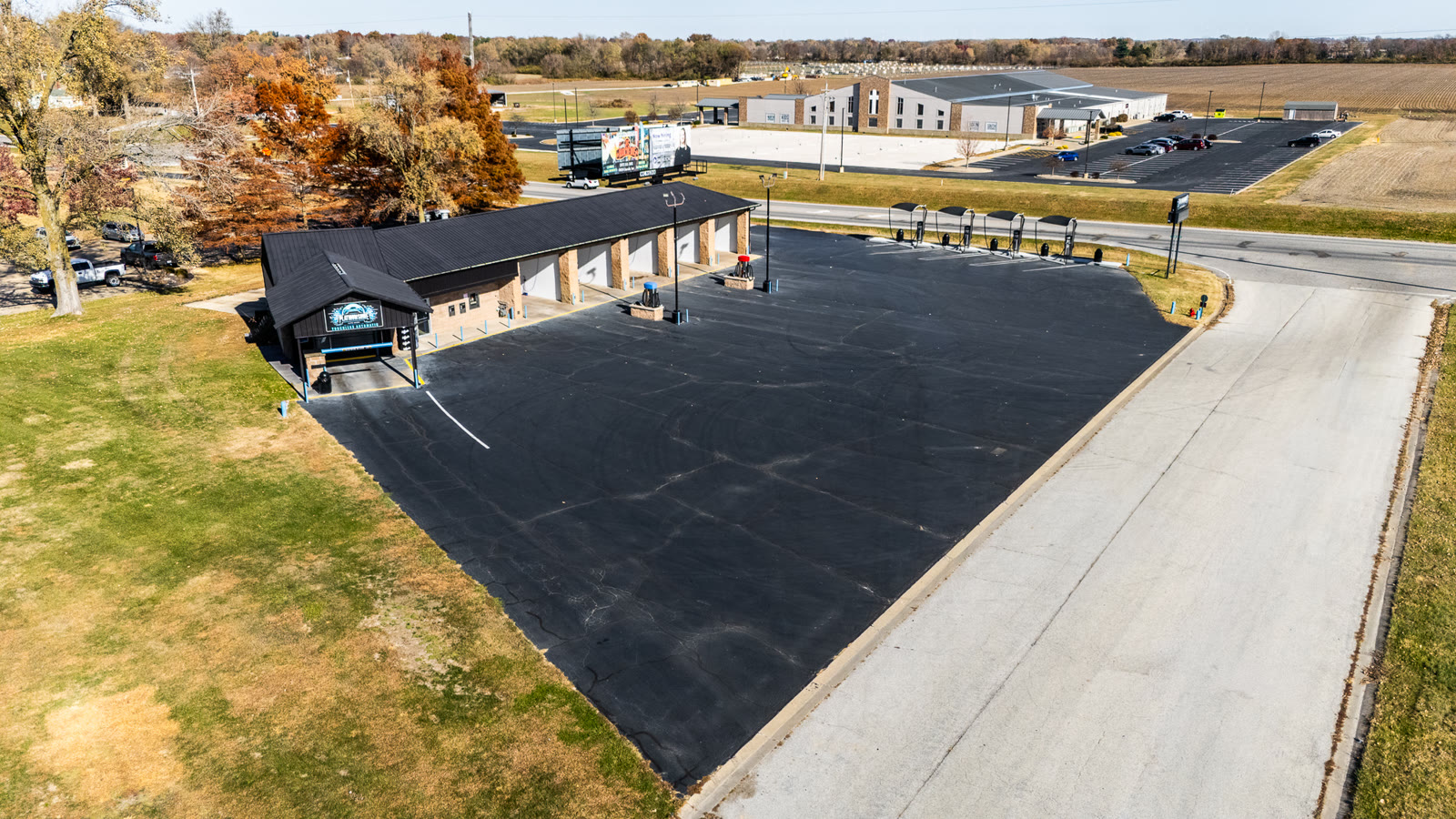 Aerial drone photo of Platinum Shine Auto Wash bays and lot in Jacksonville IL