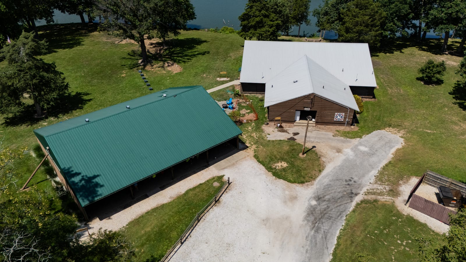 Aerial view of the 1962 Dining Hall and pavilion buildings at Western Illinois Youth Camp near the shore of Lake Jacksonville