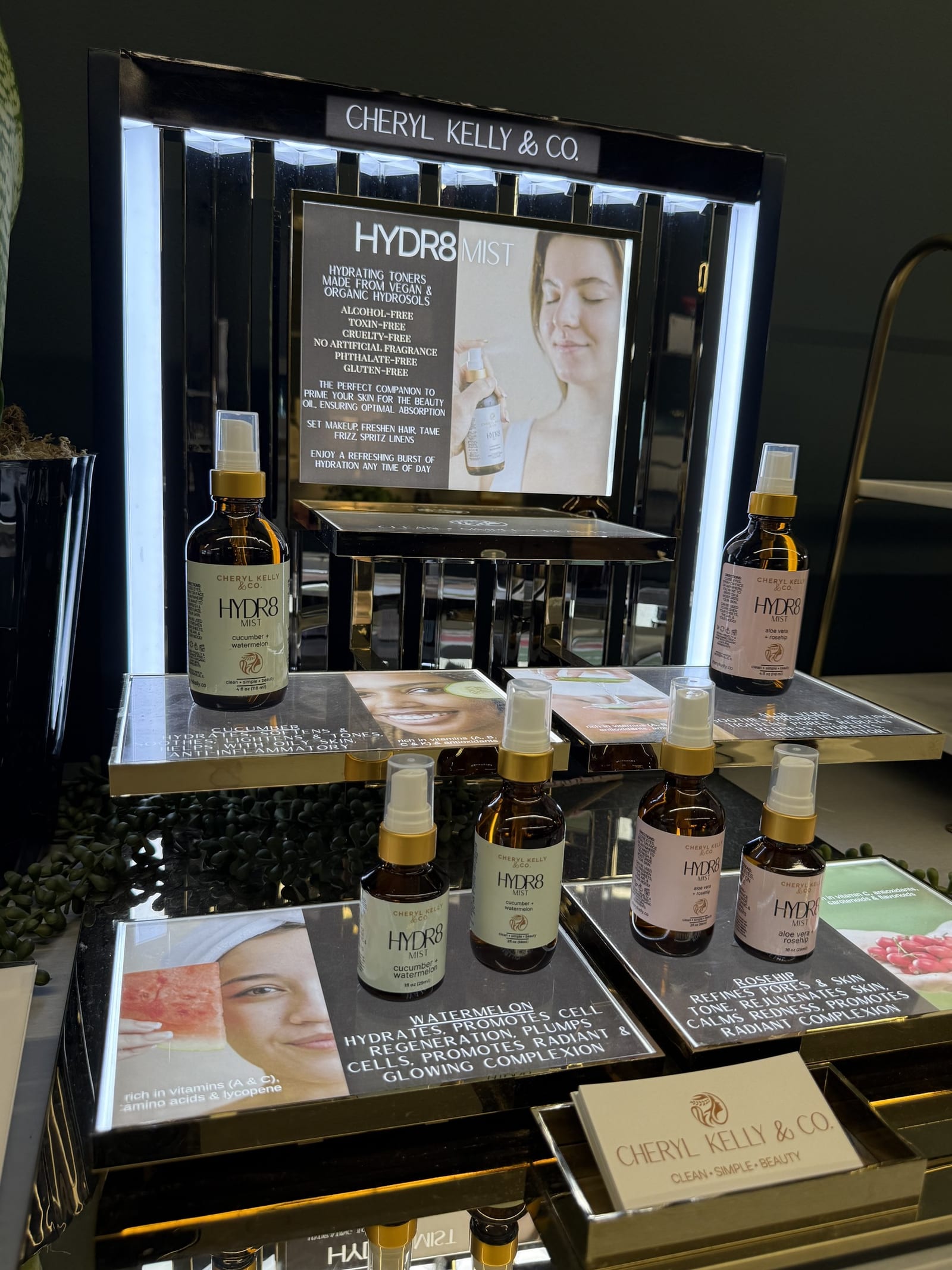 HYDR8 hydrating facial mist hydrosol bottles on a lit display at Cheryl Kelly & Co. in Jacksonville Illinois