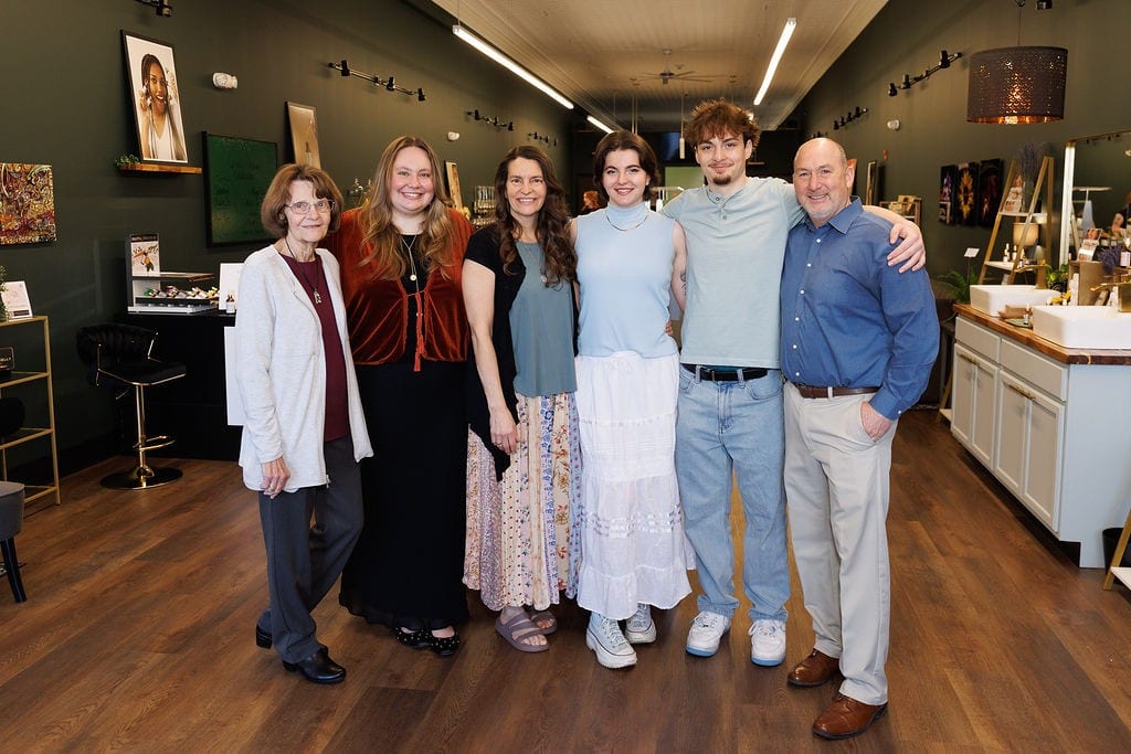The team behind Cheryl Kelly & Co., a woman-owned clean beauty business in Jacksonville Illinois, standing together inside the shop