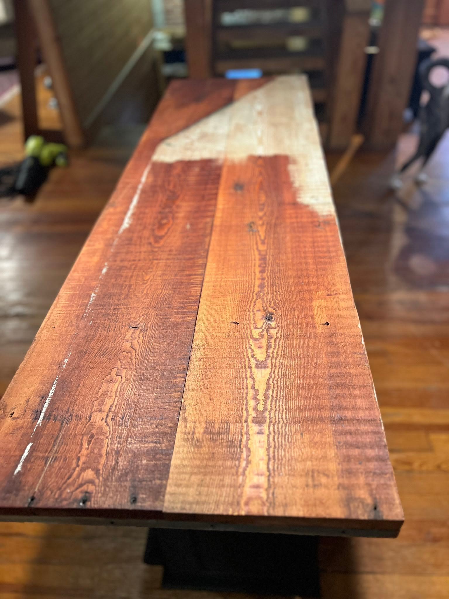 Reclaimed hardwood table top showing rich grain, saw marks, and nail holes, custom built by Jacksonville Transfer Company in Jacksonville, Illinois