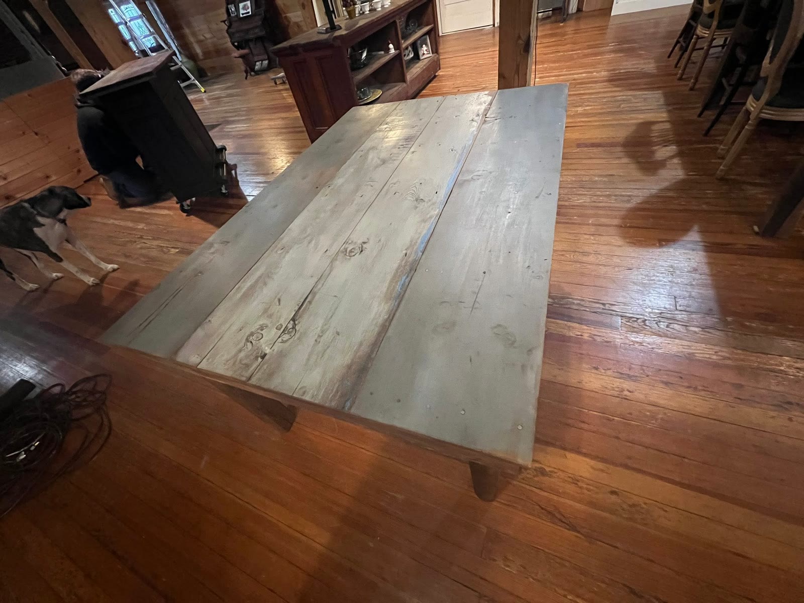 Close view of a custom table top built from weathered gray reclaimed barnwood boards at Jacksonville Transfer Company in Jacksonville, Illinois